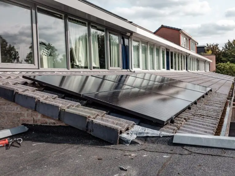 Solar panels installed on the sloped roof of a building with large windows, under a cloudy sky, showcase expert solar panel wiring Chicago residents can rely on for efficient energy performance.