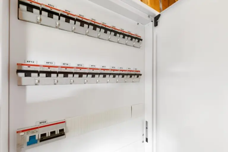 An open 200 amp electrical panel with multiple labeled switches and circuit breakers inside a white enclosure.