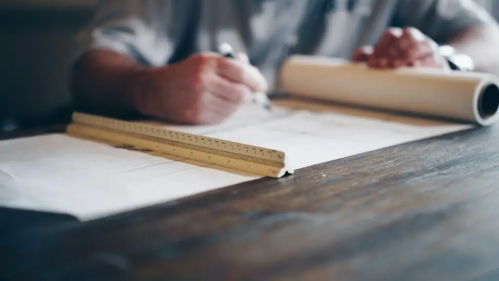 licensed electrician reviewing blueprints - commercial electrical companies near me