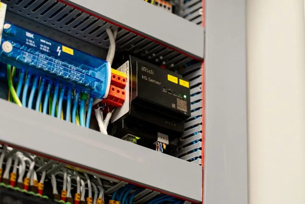automatic transfer switch next to an electrical panel
