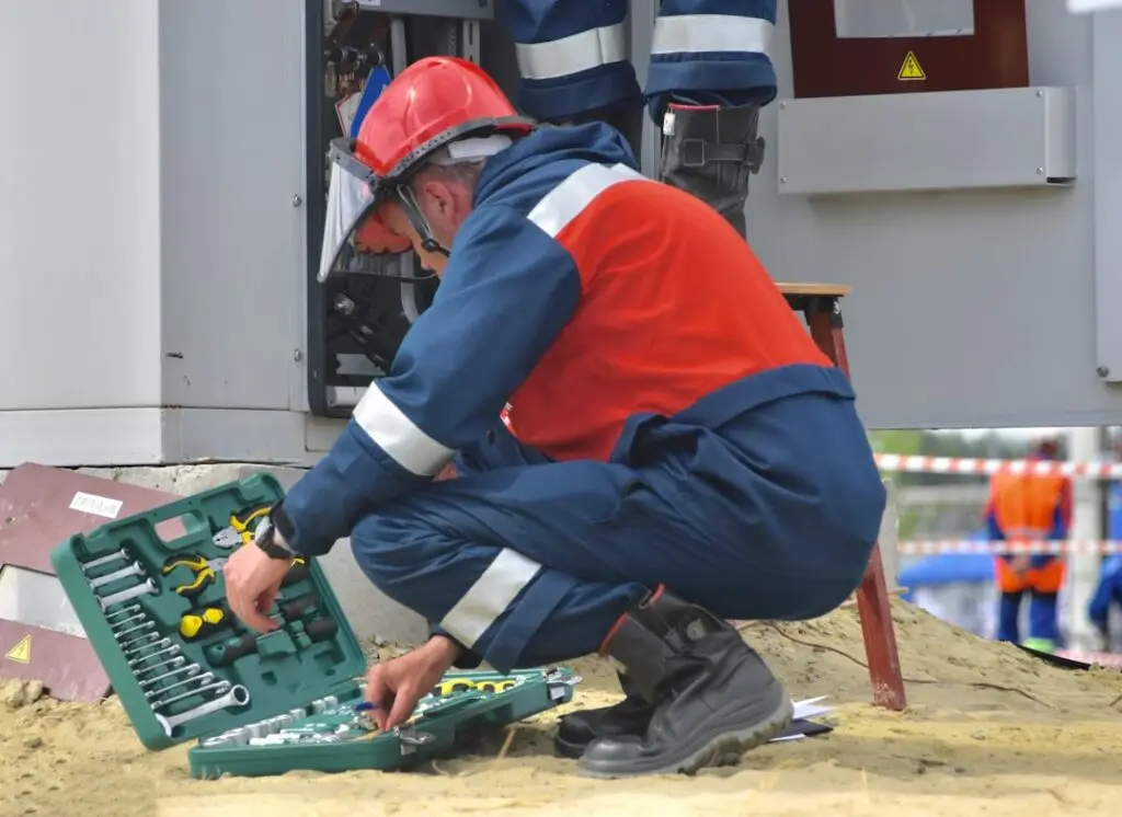 Licensed electrician performing maintenance work at a commercial jobsite