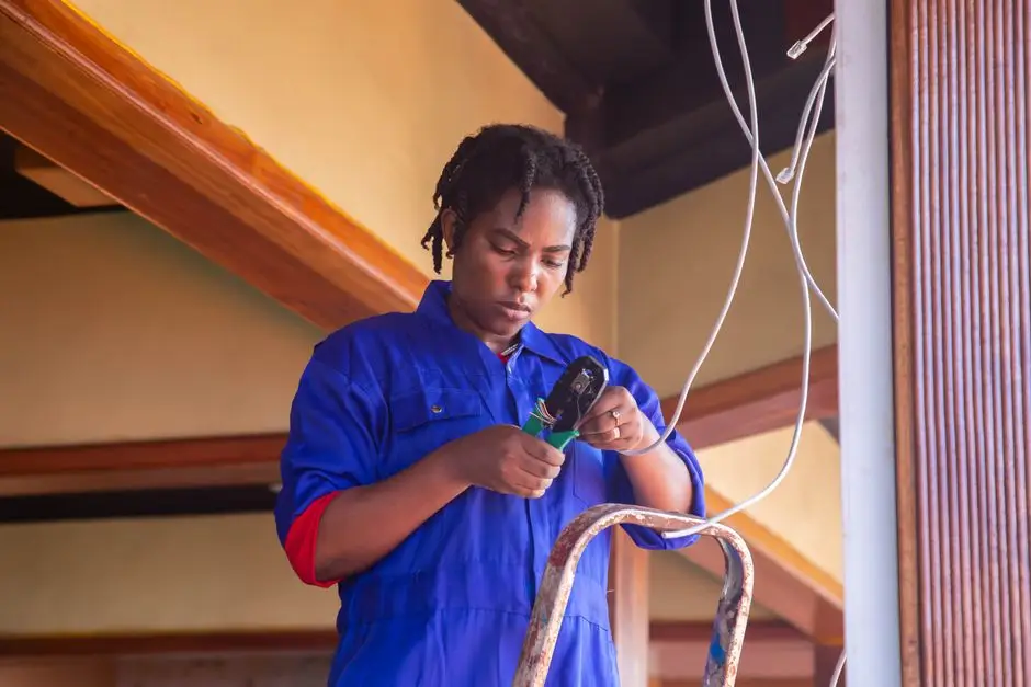 electrical technician wiring an automatic transfer switch